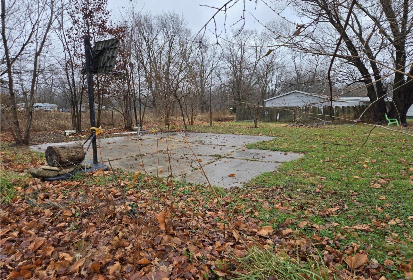 View of yard with a patio -almost a half acre lot.