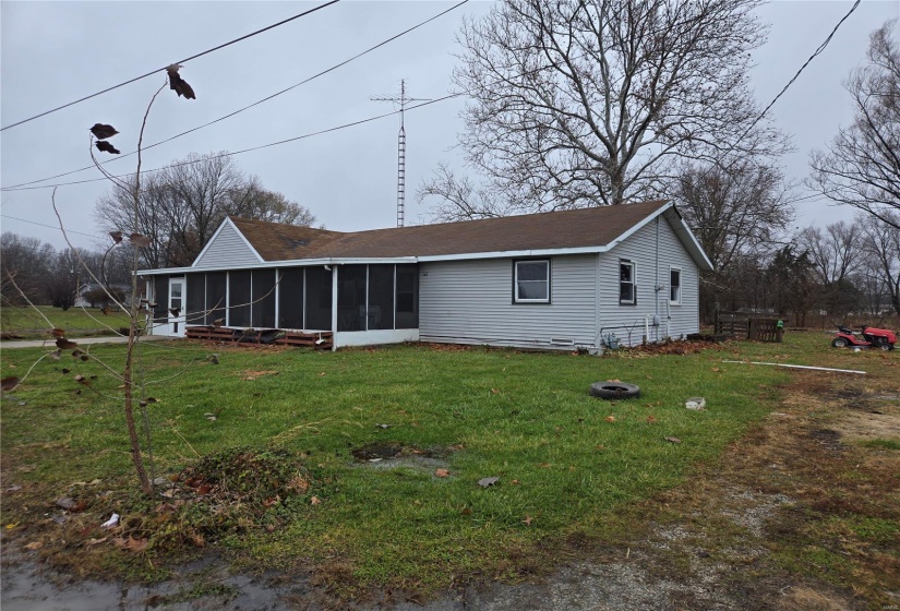 Rear view of property and yard