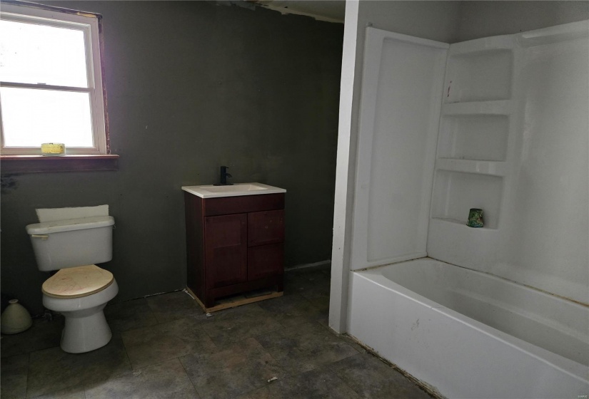 Bathroom with vanity and toilet, newer shower